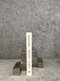 Pair of pewter bookends designed by Nicolas Schuybroek  
Minimalist pewter bookends with sculptural form  
Solid pewter bookends on a modern bookshelf  
Architectural bookends in brushed pewter finish  
Contemporary metal bookends by Belgian designer  
Close-up of Nicolas Schuybroek pewter bookends  
Elegant, heavy-duty bookends in minimalist style  
Designer bookends on a desk with stacked books  
Monolithic pewter bookends styled in a modern interior  
Sculptural pewter objects used as functional bookends
