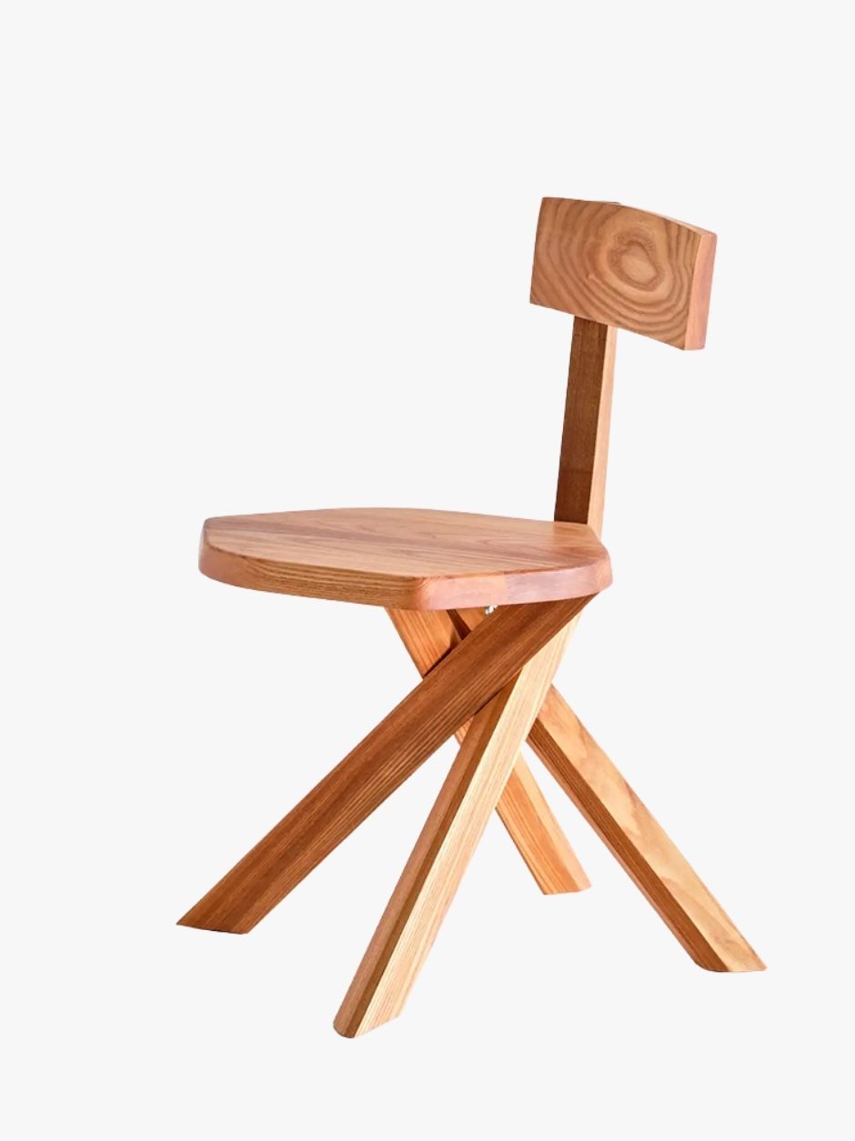 Front view of Pierre Chapo S34 dining chair highlighting the polygonal seat and architectural proportions.
