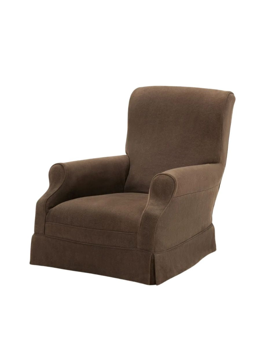 Brown armchair by Collett & Victor on a white background