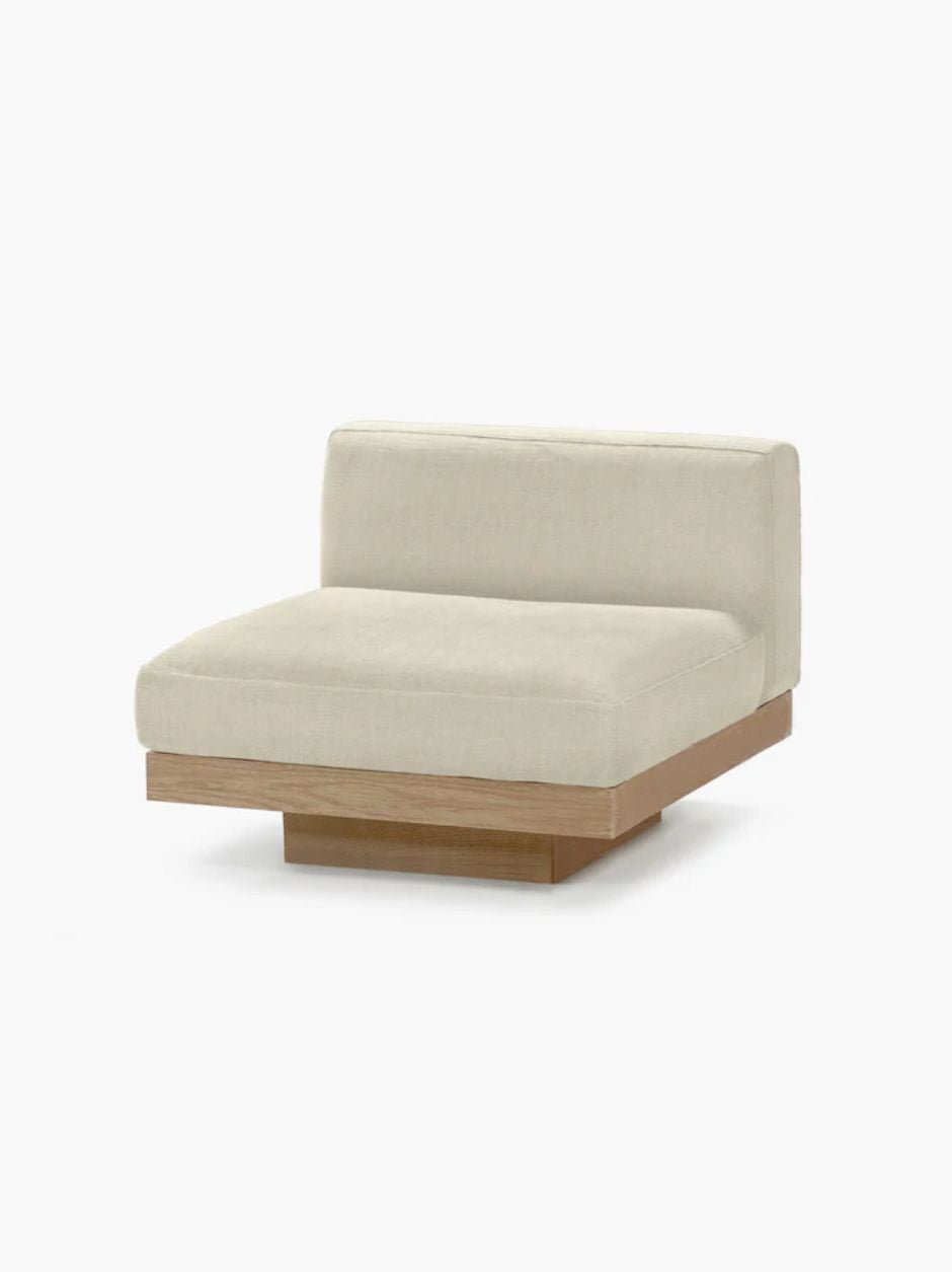 Vincent Van Duysen Rudolph one-seat outdoor lounge chair in beige oak and camel upholstery, showcasing minimalist mid-century modern design.