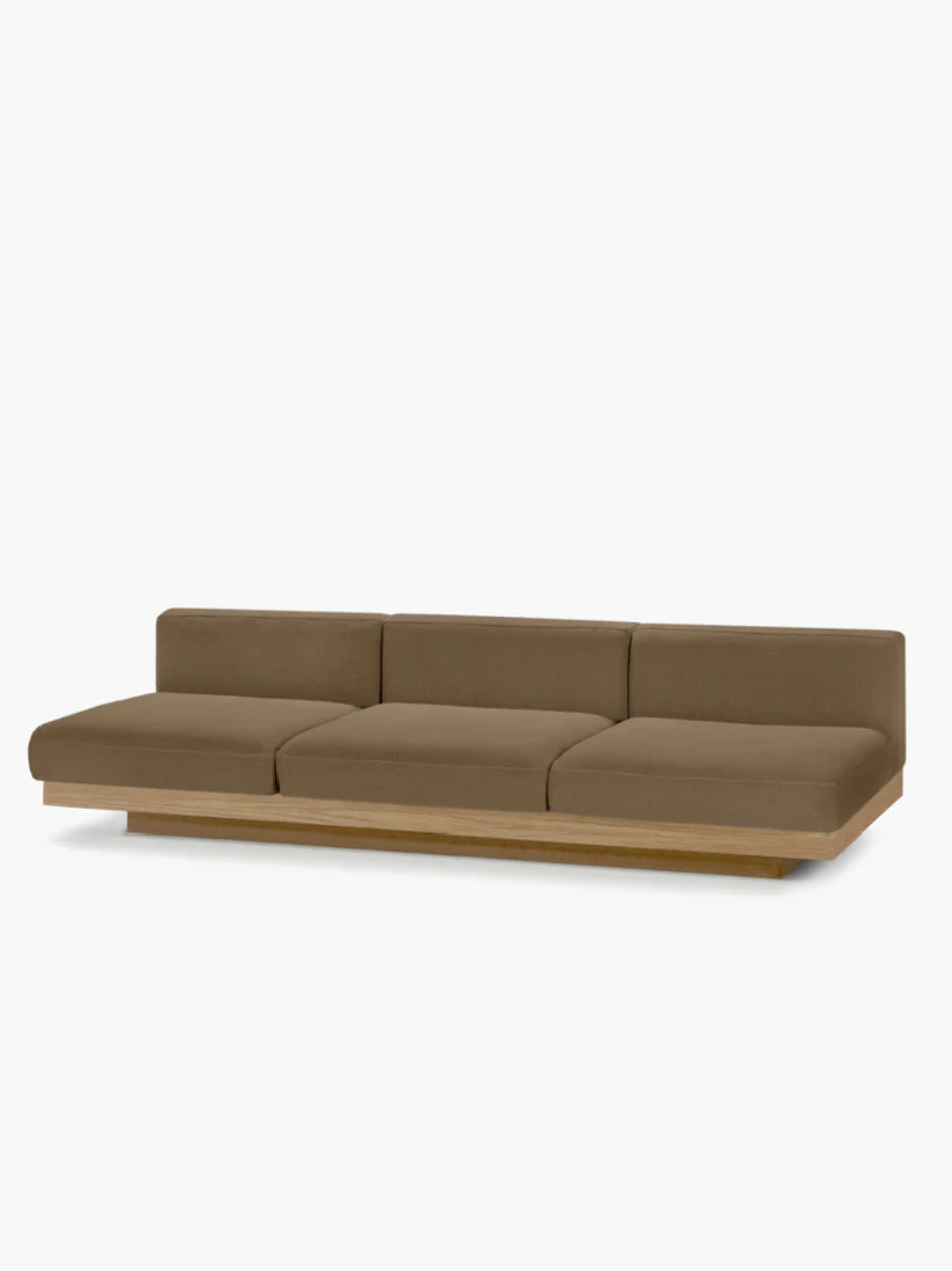 Chalk-upholstered Rudolph outdoor sofa by Vincent Van Duysen, featuring clean architectural lines and an oak-tone base.