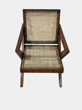 Front view of single Pierre Jeanneret cross-leg lounge chair, teak and cane, rare mid-century modern collectible from Chandigarh