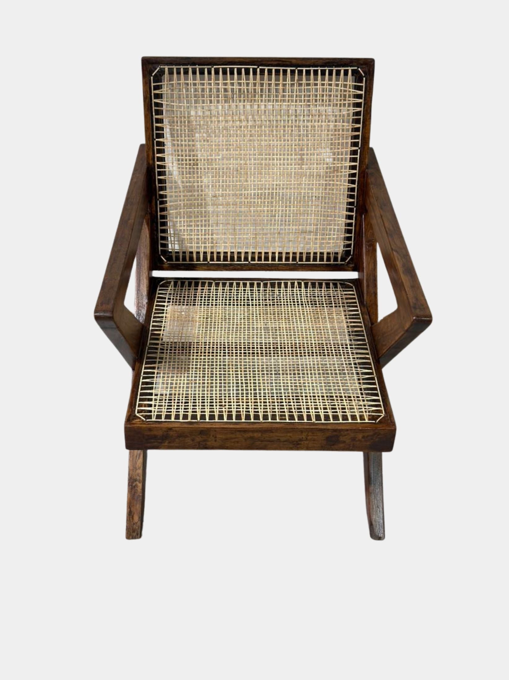 Front view of single Pierre Jeanneret cross-leg lounge chair, teak and cane, rare mid-century modern collectible from Chandigarh