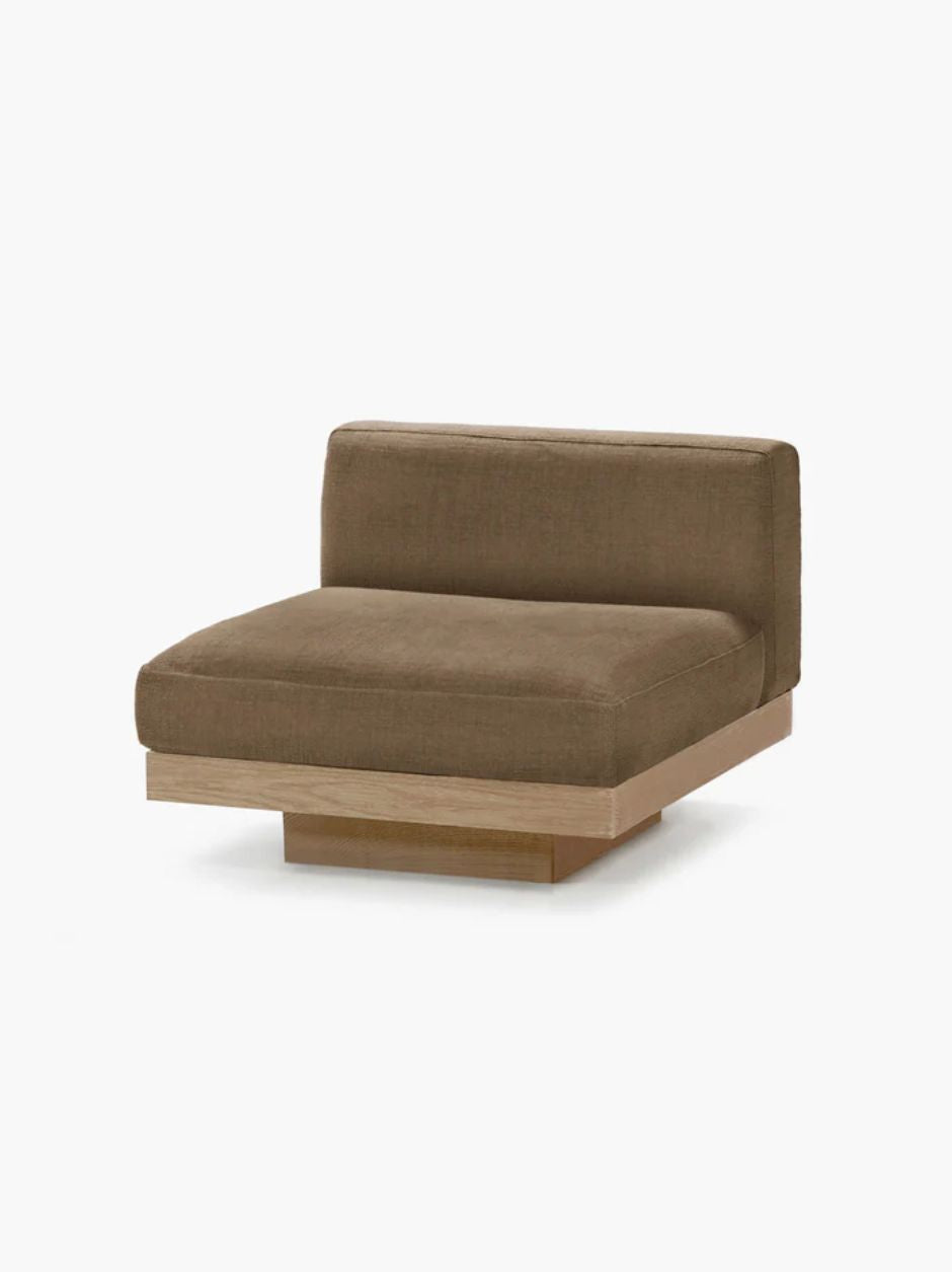 Vincent Van Duysen Rudolph one-seat outdoor lounge chair in beige oak and camel upholstery, showcasing minimalist mid-century modern design.
