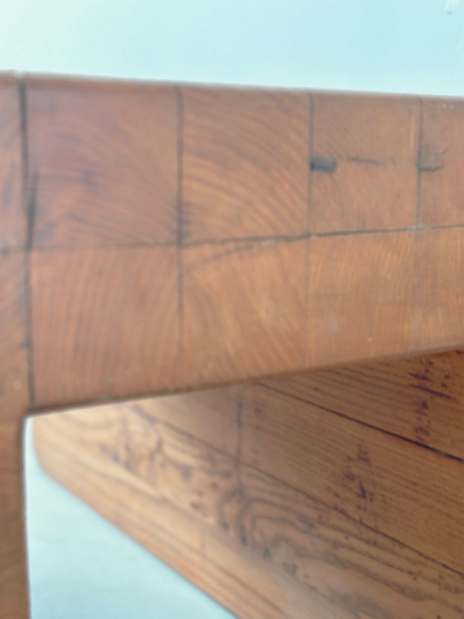 Close-up of corner joinery on solid wood stool with artisan finish