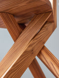 Detail of Pierre Chapo S34 chair base illustrating the geometric leg intersection and precise joinery.