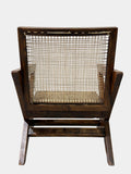 Back angle of Pierre Jeanneret X-leg lounge chair, handwoven cane backrest and teak frame, original H.C.S. markings