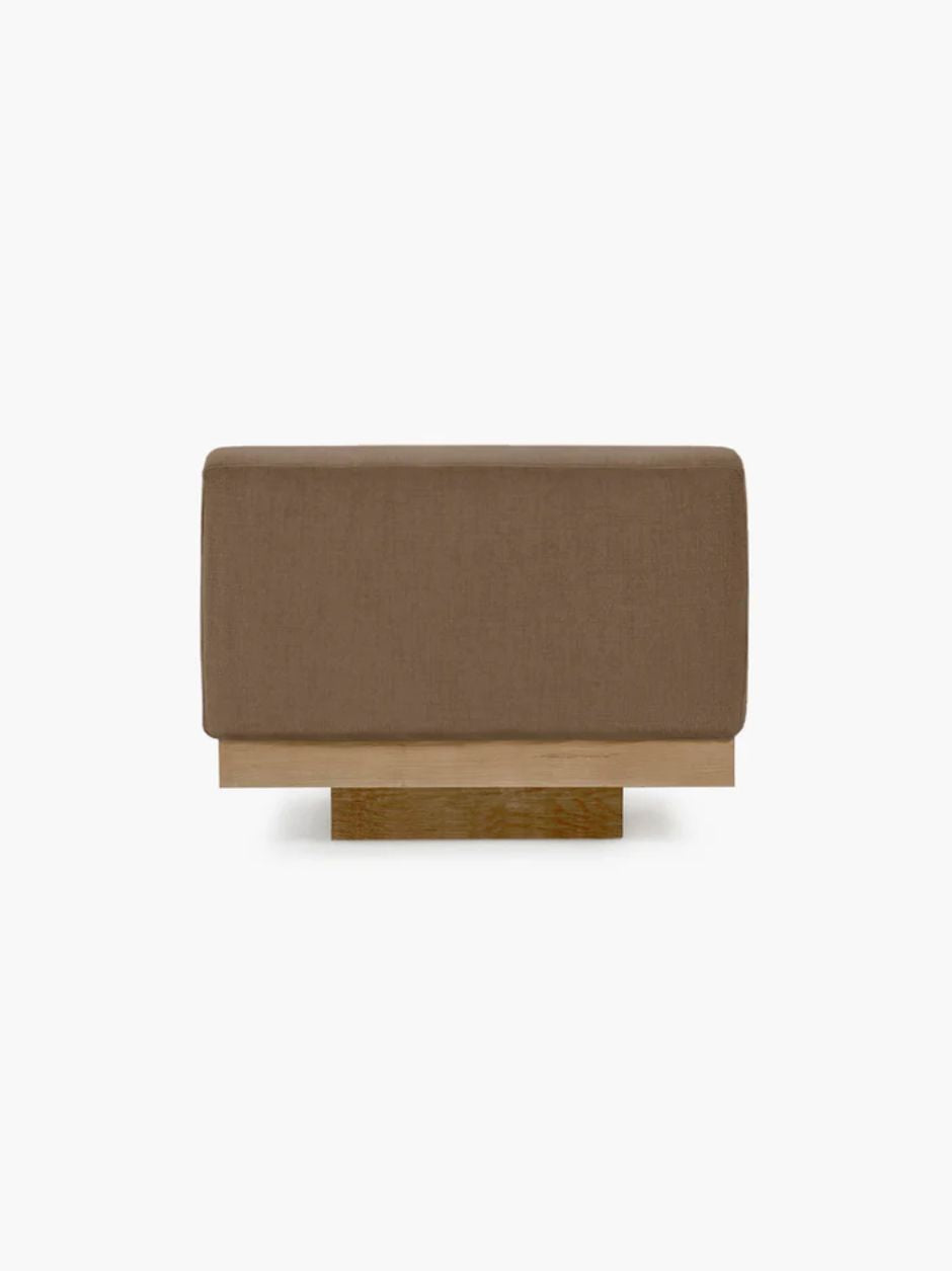 Vincent Van Duysen Rudolph one-seat outdoor lounge chair in beige oak and camel upholstery, showcasing minimalist mid-century modern design.