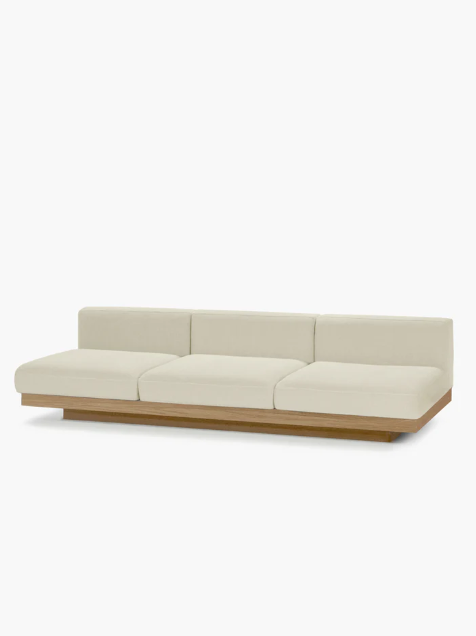 Chalk-upholstered Rudolph outdoor sofa by Vincent Van Duysen, featuring clean architectural lines and an oak-tone base.