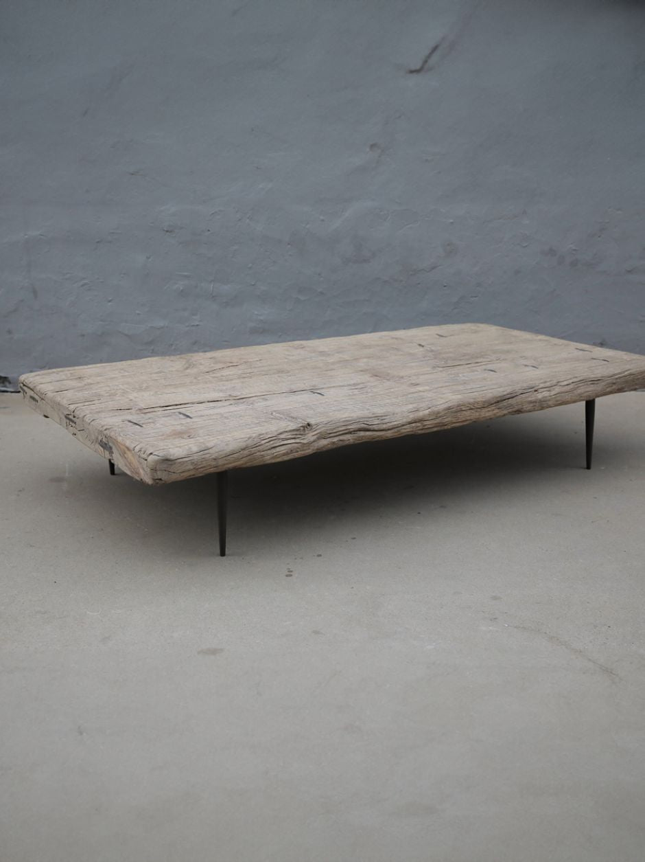 19th century Chinese poplar coffee table with thick solid wood top and minimalist metal legs, rustic antique design for modern interiors.