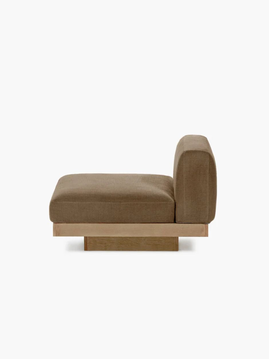 Vincent Van Duysen Rudolph one-seat outdoor lounge chair in beige oak and camel upholstery, showcasing minimalist mid-century modern design.