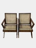 Front angle of two Pierre Jeanneret cross-leg lounge chairs, authentic mid-century modern design from Chandigarh, H.C.S. marked