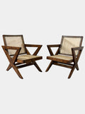 Front view of original Pierre Jeanneret X-leg lounge chairs, set of 2, teak and handwoven cane, Chandigarh High Court Secretariat provenance