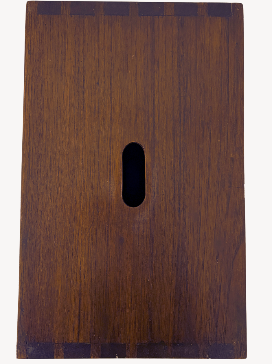 Close-up of handle opening on Cabanon stool by Le Corbusier