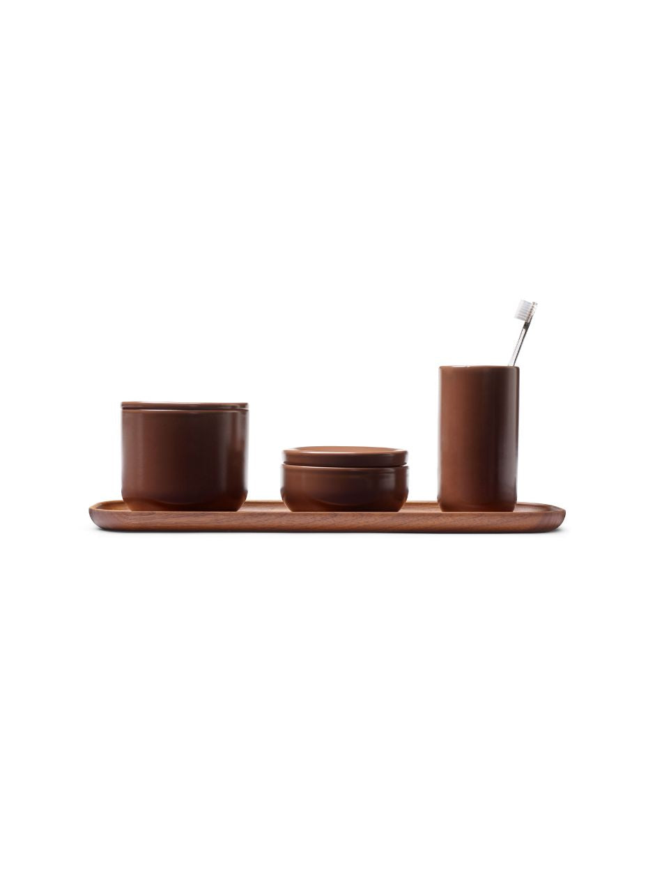 Vincent Van Duysen mocca brown ceramic bathroom set with large and small stoneware containers, toothbrush goblet, and matching tray.
